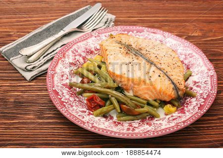 Salmon steak, veggies and herbs. Healthy eating concept