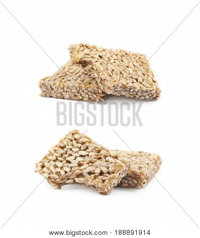Two pieces of gozinaki confection sweets isolated over the white background, set of two different foreshortenings