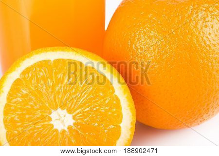 Orange Juice. Isolated Drink. A Glass Of Orange Juice And Pieces Of Orange Fruit Isolated On White B