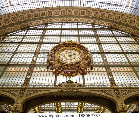Paris, France, March 28 2017: Golden clock of the museum D'Orsay.The Musee d'Orsay is a museum in Paris, on the left bank of the Seine