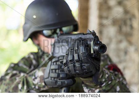 A Soldier With A Gun Assaults The Building. Military Actions And Assault Of Buildings