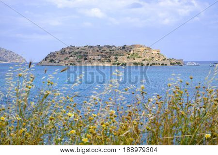 The fortress island of Spinalonga Crete a leper colony a century ago seen from Elounda side.