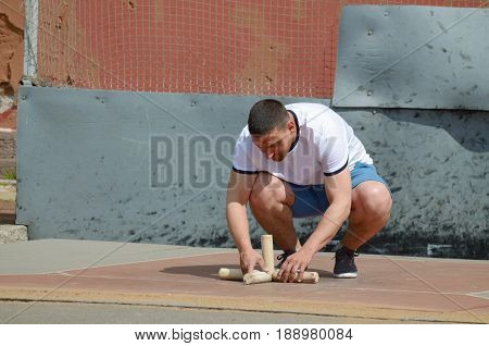 21.05.2017.Russia.Saint-Petersburg.Gorodki - a Russian folk sports game. In this game you need specific distances to smash figures made in different ways from five wooden cylinders.