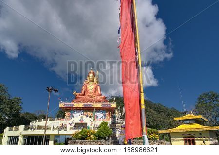 Samdruptse statue a huge buddhist memorial statue in Sikkim blue cloudy sky in background. It is a favourite tourist spot in Sikkim.