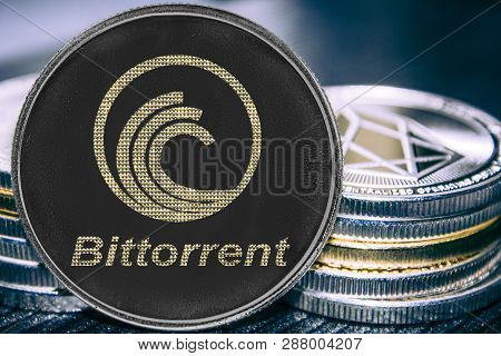 Coin Cryptocurrency Bittorrent On The Background Of A Stack Of Coins. Btt