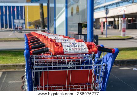 Lomme,france-february 24,2019: Close-up Shopping Trolleys Carrefour Supermarket.carrefour Is An Inte