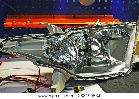 Macro View Of Repairing, Installation And Turning Headlight Of Modern Automobile And Car Projector L