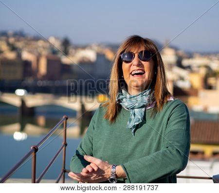 Mature And Beautiful Woman Poses On A Terrace And In Front Of The Florentine Cathedral, Santa Maria 