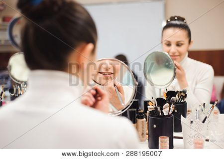 School Of Makeup. Make Up Artist Doing Professional Make Up Of Young Woman. Beauty Shcool
