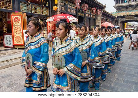 Aug 2013 - Pingyao, China - Traditional Costume Parade That Happens Every Morning In The South Stree