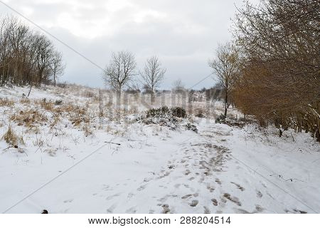 Footpath On The Top Of Cheddar Gorge In Somerset On A Snowy Day