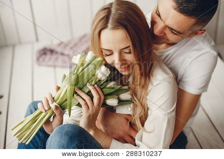 Cute And Elegant Family In A White Rom