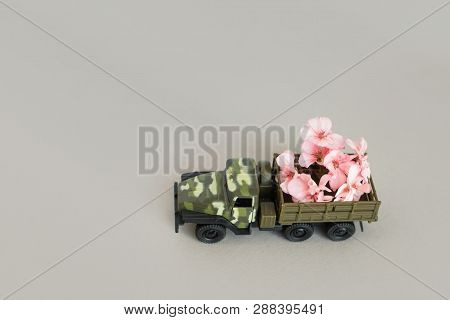 War Machine With A Flower In The Back, Peace And War, Military Action, A Flower In The Barrel Of A T