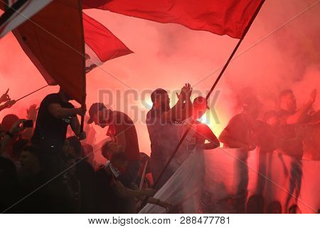 Bucharest, Romania - July 28, 2018: Dinamo Bucharest Supporters Hold Torches During The Game Between