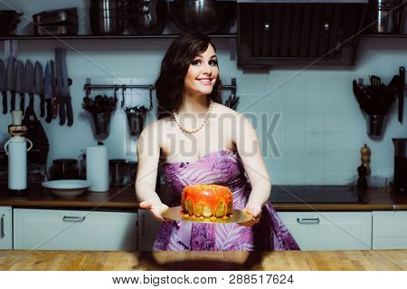Smiling Hostess Holds Cake Like Big Donut With Fondant