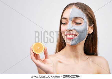 Close Up Portrait Of Young Emotional Beautiful Woman With Lemon In Her Hands