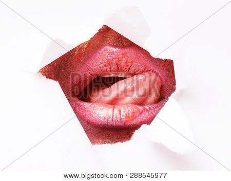 Intimate Care And Tenderness. Young Woman Erotically Playing With Tongue, Licking Her Lips In Paper 