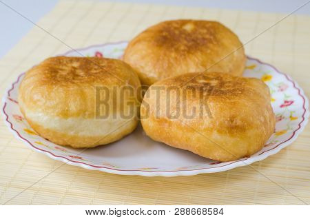 Traditional Russian Meat Pies Belyashi On A Plate.