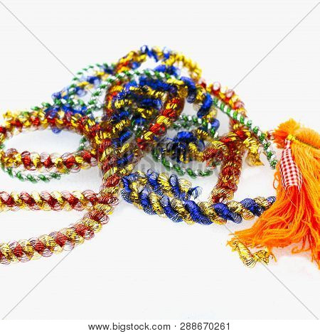 Colorful Frippery Placed On White Background, Studio Closeup