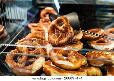 Germany National Bakery - Brezel. Close Up Fresh Pretzel On Bread Shelf In Store. Take A Fresh Bavar