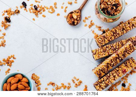 Cereal Granola Bar With Nuts, Fruits And Berries On A Whhite Stone Table. Granola Bar. Healthy Snack