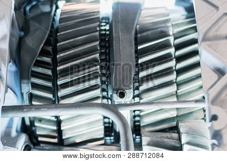 The Inner Structure Of The Automotive Gearbox. Visible Helical Gears And Wheels.
