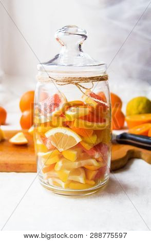 Lemons, Oranges, Tangerines, Grapefruit, Cut Into Slices And Folded Into A Jar