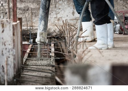 Concrete Casting Work. Using Concrete Vibrator For Compacting Concrete Of Stiff Consistency. Selecti