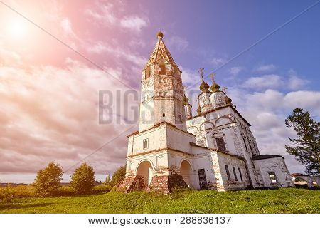 Old Orthodox Church At Village. Summer View With Floral Meadow. Sun Flare