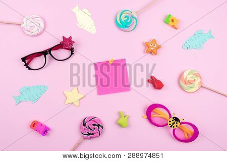 Festive Funny Celebration Background With Paper Fish, Sticky Note And Decor On Pink Background. All 