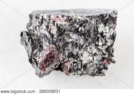 Macro Photography Of Sample Of Natural Mineral From Geological Collection - Raw Red Garnet Crystals 