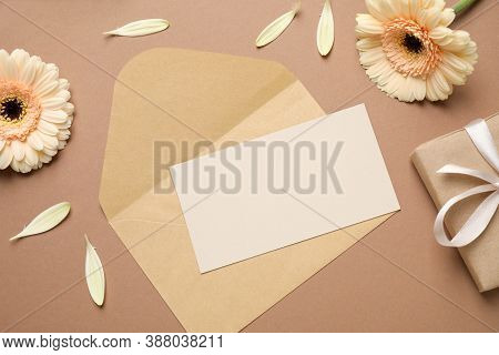 Beautiful Herbera Flowers, Gift, Envelope And Blank Card With Space For Text On Brown Background, Fl