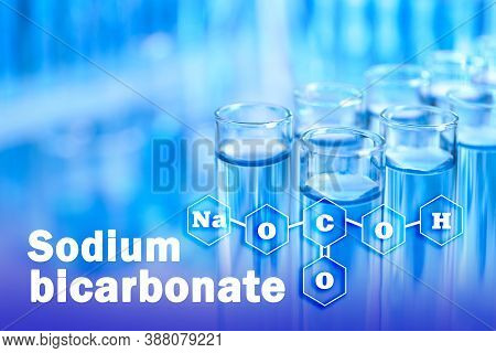 Text Sodium Bicarbonate With Soda Formula And Test Tubes On Background