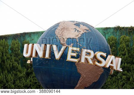 Konohana, Osaka, Japan November 20, 2017: Rotating Globe Of  Universal Earth And Background Green Tr