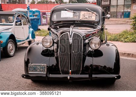 Toronto, Canada - 08 18 2018: Black 1937 Plymouth P4 Deluxe Oldtimer Car Made By American Automobile