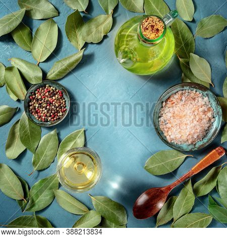 Square Design Template For Seafood Or Sauce Recipe. A Flat Lay Composition Of Bay Leaves, Salt, Pepp