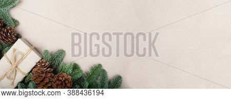 Traditional Green Christmas Tree Noble Fir Cones And Simple Gift Box Border Frame On Craft Paper Bac