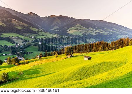 Romantic Sunset In The Mountains. Green Alpine Meadows And High Peaks Of Austrian Alps. Salzach Rive
