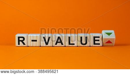 Symbol For A Lower R-value, Reproduction Rate, Of The Corona Virus. Beautiful Orange Background. Bus