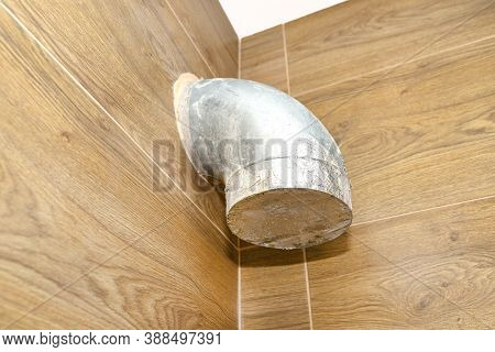 Modern Gas Boiler Room With Brown Ceramic Tiles Imitating Wood, Visible Air Inlet And Outlet, Prepar