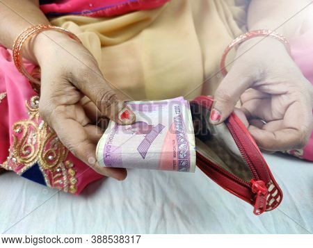 Money Keeping In Ladies Purse , Hands And Wallet Closeup , India Woman In Saari Put Notes Into Purse