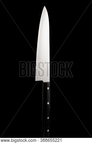 Japanese chef knife with damascus pattern isolated on black background