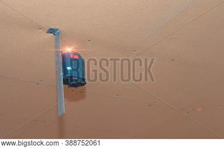 Laser Level On The Ceiling.blue Laser Level Tool. Installing Of Stretch Ceiling