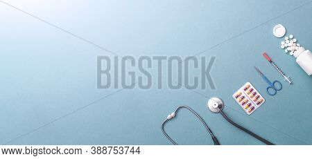 Pills, Ampoule, Syringes, Capsules, Stethoscope On The Blue Doctor S Table. Copy Space. Place For Te