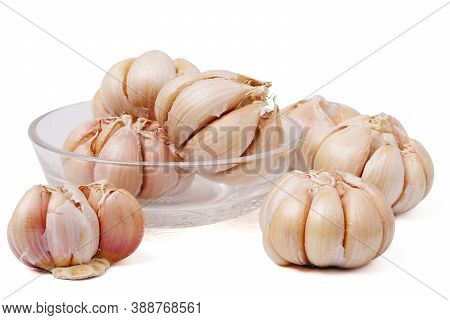 Garlic Cloves And Bulb In Glass Bowl Isolated On White Backgroound. Fresh Gralic Cloves. Pile Of Gar