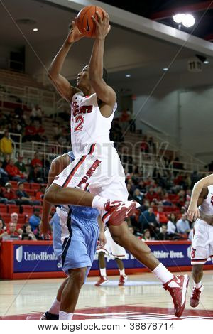 NEW YORK-NOV 3: St. John's Red Storm center Chris Obekpa (12) skyder over Sonoma stat Seawolves gua