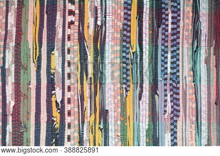 Fabric Scraps, Old Clothing And Textiles Are Cut Into Strips And Grouped Together, Forming Diagonal 