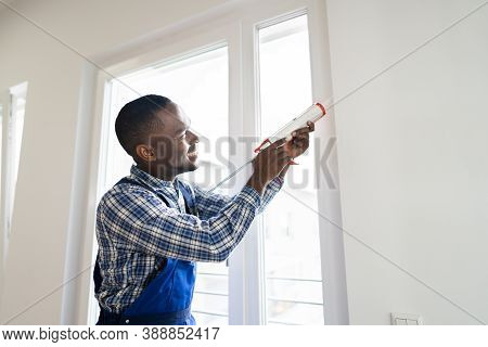 Caulk Sealant Application. Silicone Window Seal And Waterproofing