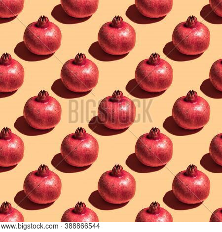 Seamless Pattern With Pomegranate Fruit On Yellow Background.