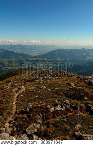 Beautiful Landscape With High Cliffs And Illuminated Peaks, Blue Sky And Trails Of The Montenegrin R